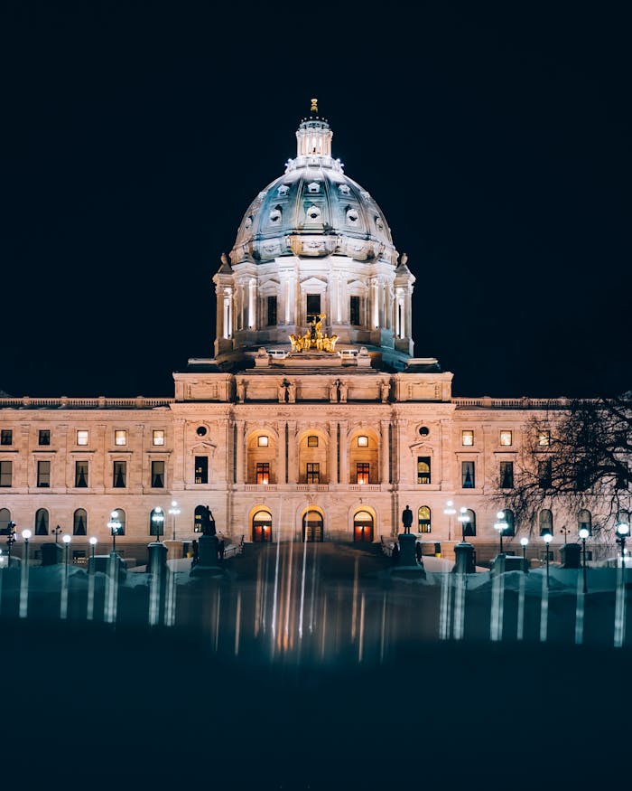 A majestic dome building beautifully lit at night, showcasing grand architecture.